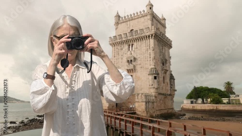 Senior Tourist Photographer Taking Pictures at Bel�m Tower Landmark in Lisbon  