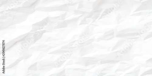 Photos Crumpled white paper texture background with creases and folds