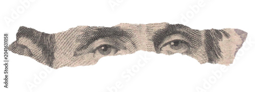 Close-up of Abraham Lincoln Eyes on a Torn Five Dollar Bill