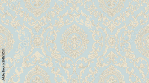 Intricate damask pattern texture with pale blue and cream tones suitable as elegant background for design projects.