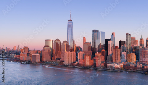 New York skyline with Tower in panoramic dusk view. NYC panoramic landscape at dusk. New York City wide panoramic skyline at dusk. New York aerial panoramic view of Manhattan skyscrapers.