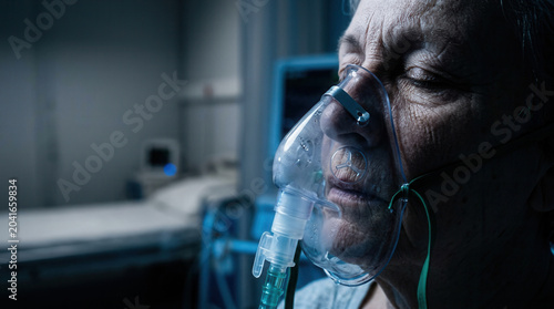 Patient In Hospital With Oxygen Mask, Medical Care And Health Issues