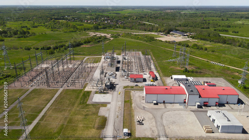 Photos Aerial view showing a large electrical substation distributing high power to an
