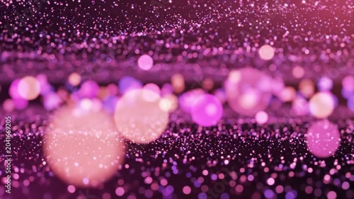 Abstract shimmering pink glitter background with bokeh effect and light particles creating an elegant flowing motion