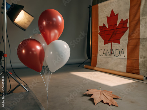Two red balloons featuring the canadian flag design
