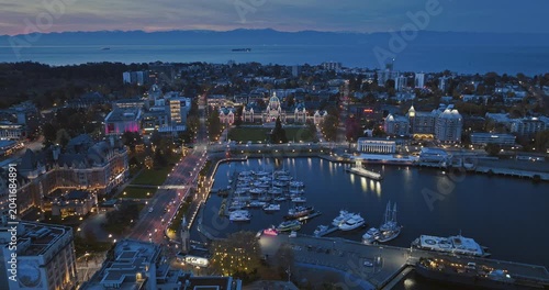 Aerial view of BC Legislative Parliament Building near harbor at night in Victoria, British Columbia, Canada	
