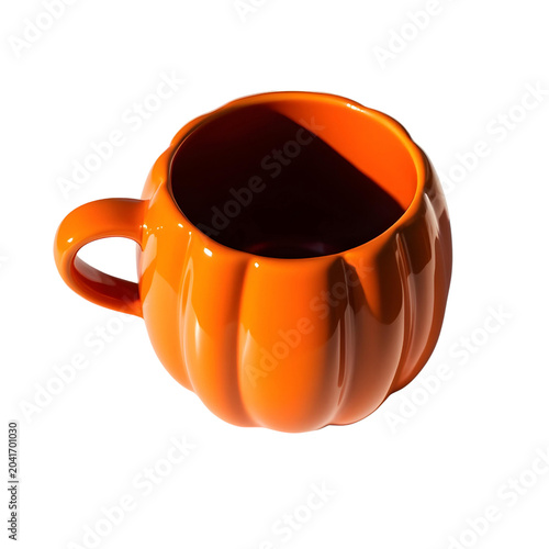 A glossy orange pumpkin-shaped mug sits on a white surface, casting a soft shadow on transparent background