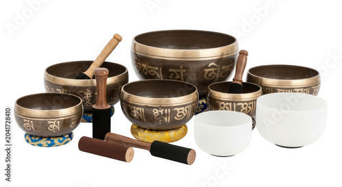 Tibetan singing bowls with wooden mallets.