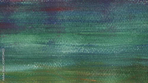 Abstract close-up macro texture of acrylic painting canvas surface with horizontal teal green blue red pink and yellow multicolor brushstroke pattern