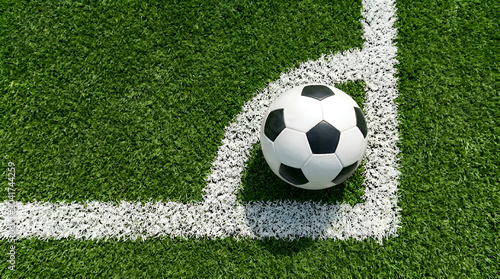 Close-up of a soccer ball resting in the corner of a pristine green grass field, ready for a match