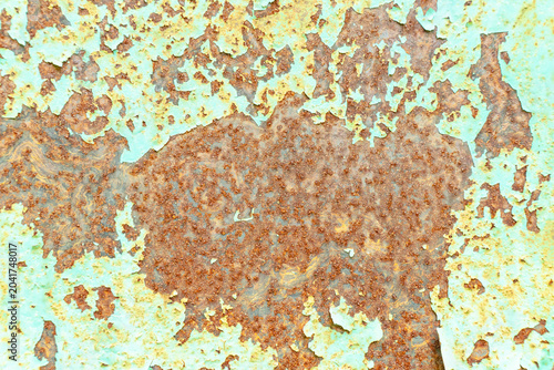 Canvas Print Rusty metal surface with peeling paint creating an abstract weathered texture background