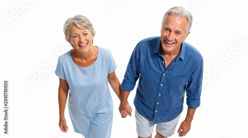 High angle portrait of a smiling senior Caucasian couple holding hands. Happy older man and woman in casual summer clothing on white background. Active retirement and relationship concept. Copy space