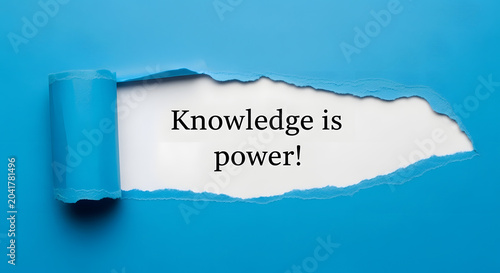 Blue paper torn revealing white background with text Knowledge is power image