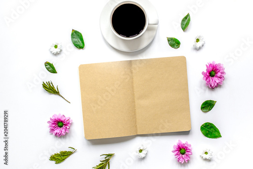 Obraz na płótnie Petals, cup and copybook on table background top view mock up
