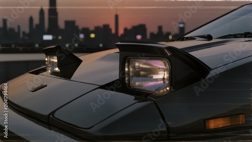 Close Up of a Retro Sports Car Pop-Up Headlight and Side Mirror at Sunset