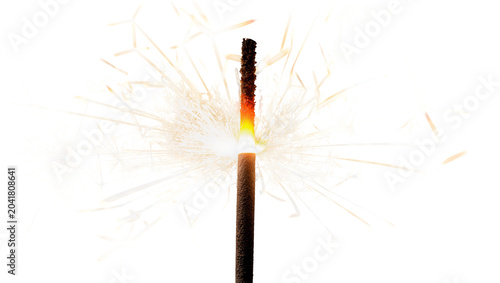 Tableau sur toile Sparkler burning with bright orange sparks and light
