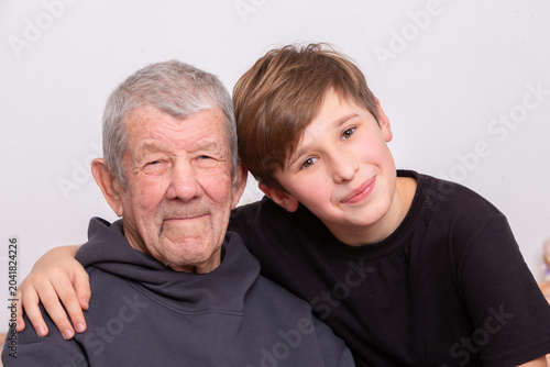 Принти на полотні Grandfather and grandson share a joyful moment together in a warm embrace at hom