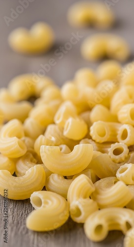 Uncooked Elbow Macaroni Pasta Scattered on Rustic Wooden Table
