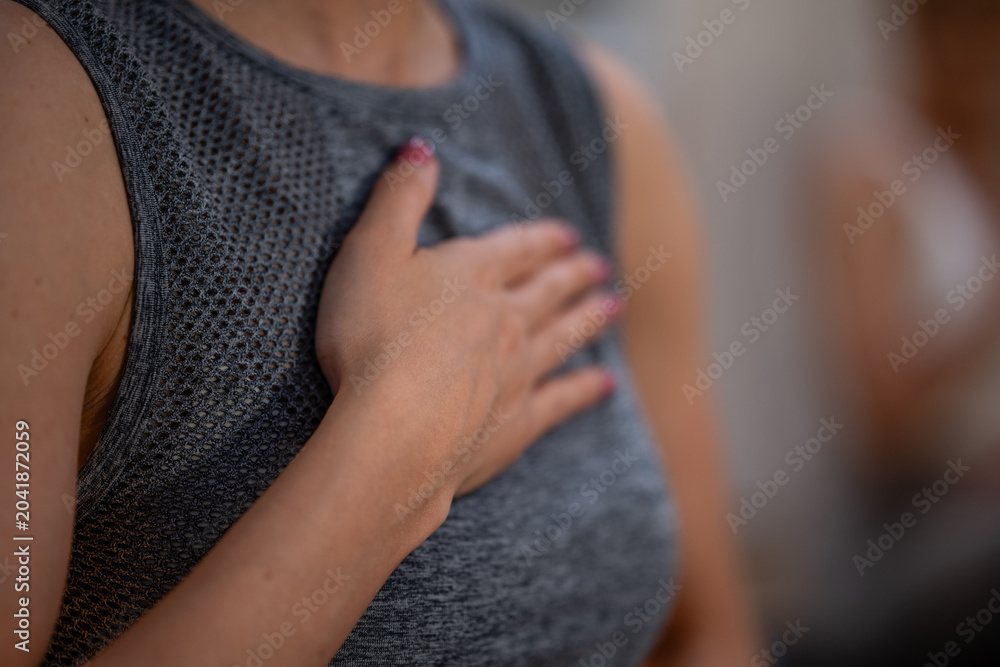 Ταπετσαρία Woman holding hand over chest feeling gratitude