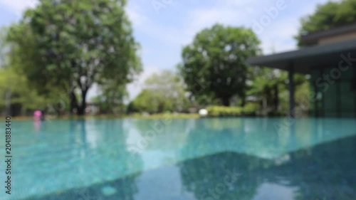 Abstract blur outdoor swimming pool in tropical resort hotel summer background