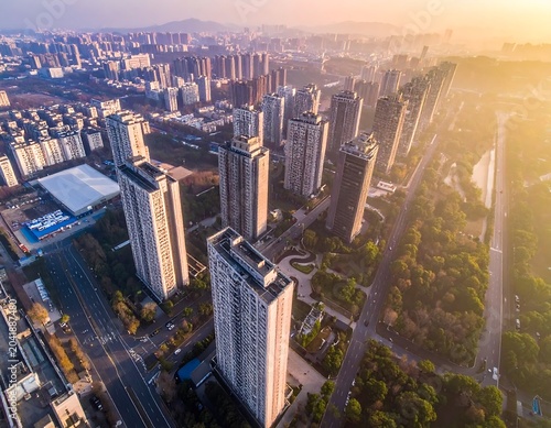 Golden Urban Skyline with Tall Residential Towers at Sunrise in Modern City District