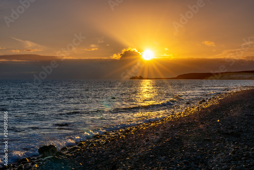 Dramatic Sunset Over Meloneras Promenade with Distant Factory Silhouette
