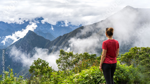 Tablou pe pânză Hiker woman standing and enjoying scenic view of Andes mountains