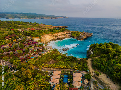 Aerial view of luxury resort villas and turquoise bay on Nusa Ceningan