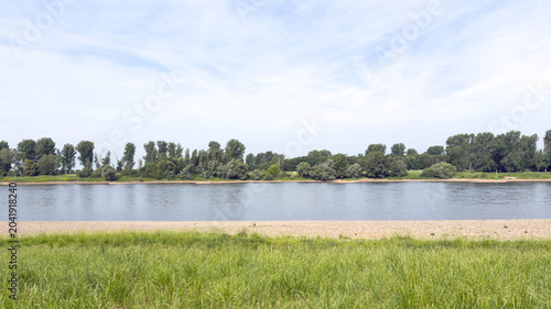Tableau sur toile View on the scenic River Rhine in Duesseldorf Urdenbach Germany in Spring 2026