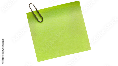 Lime green sticky note with silver paper clip