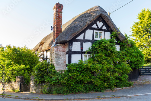 old cottage, black and white, thatched roof and timber frame 