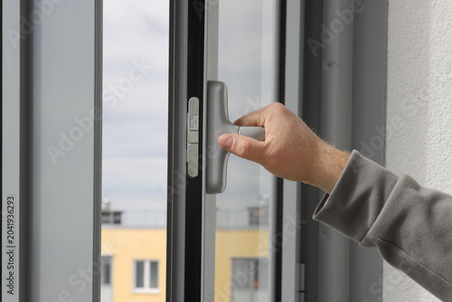 Aluminum window open detail. Metal door frame closeup view.