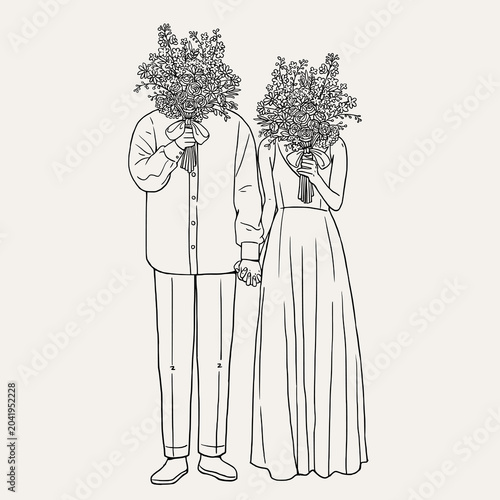Photography Full body wedding couple holding hands and hiding faces behind big flower bouque
