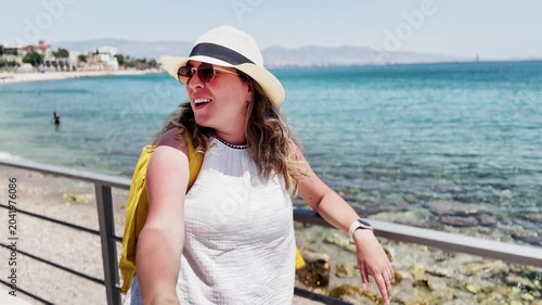 Travel Vlogger's Candid Moment on Athens Coastline