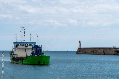A suction dredger with a grab arrives in the port of Les Sables d'Olonne, Vendée, France