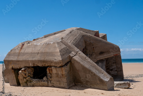 Abandoned concrete military bunker near ocean shore