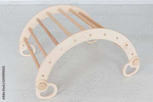 Wooden montessori climbing arch for toddlers developing motor skills