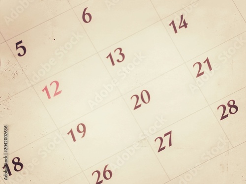 Close up of a calendar pages and old times.