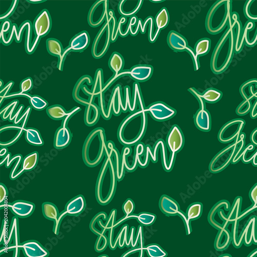Seamless pattern with leaves and lettering Stay Green. Vector illustration.