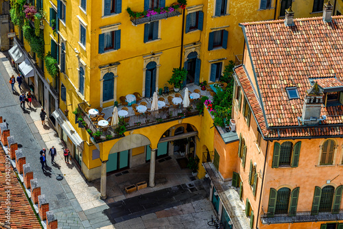 Old street with tables of  restaurant in Verona, Italy. Architecture and land...