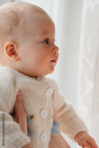 Cute Baby Looking Away in Soft Sunlight