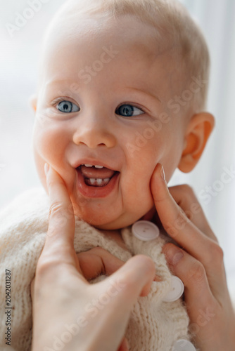 Happy Smiling Baby Showing First Teeth