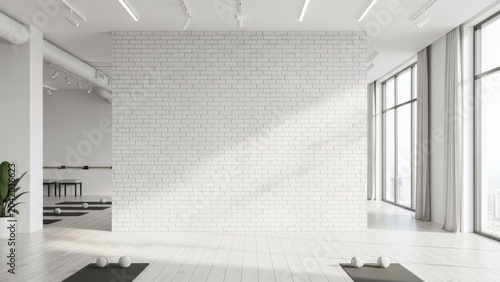 Modern yoga studio with white brick wall and large windows