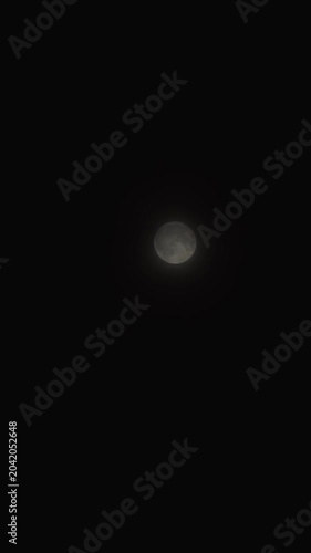 Full moon shining on a night sky