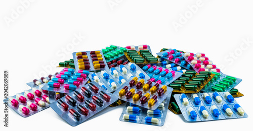 Obraz na płótnie Colorful of antibiotic capsule pills isolated in blister pack isolated on white background with copy space