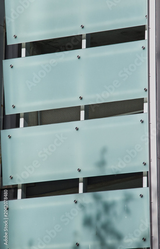Bild auf Leinwand opaque glass panels on buildings facade