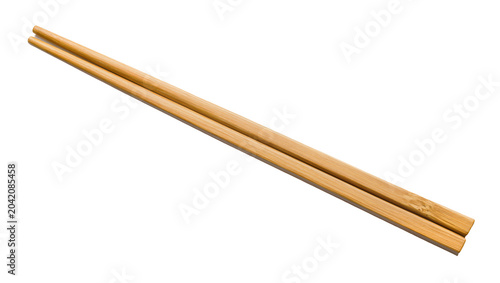 Foto Pair of natural bamboo chopsticks angled diagonally