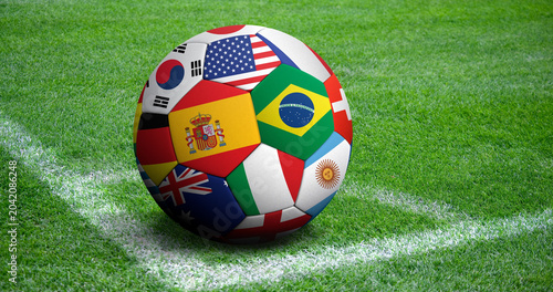 Billede på lærred Soccer ball with various national flags on a green grass field background, repre