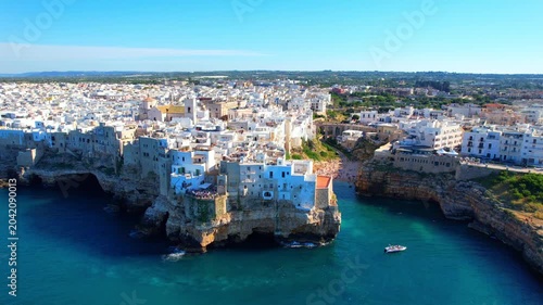 Polignano a Mare - Italy, Apulia - clockwise aerial view along the houses on the cliffs