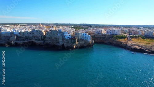 Polignano a Mare - Italy, Apulia - rising aerial view of the houses on the cliffs